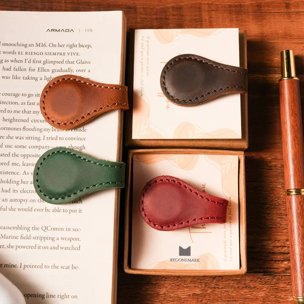 Leather magnetic bookmark clipped on open book page
