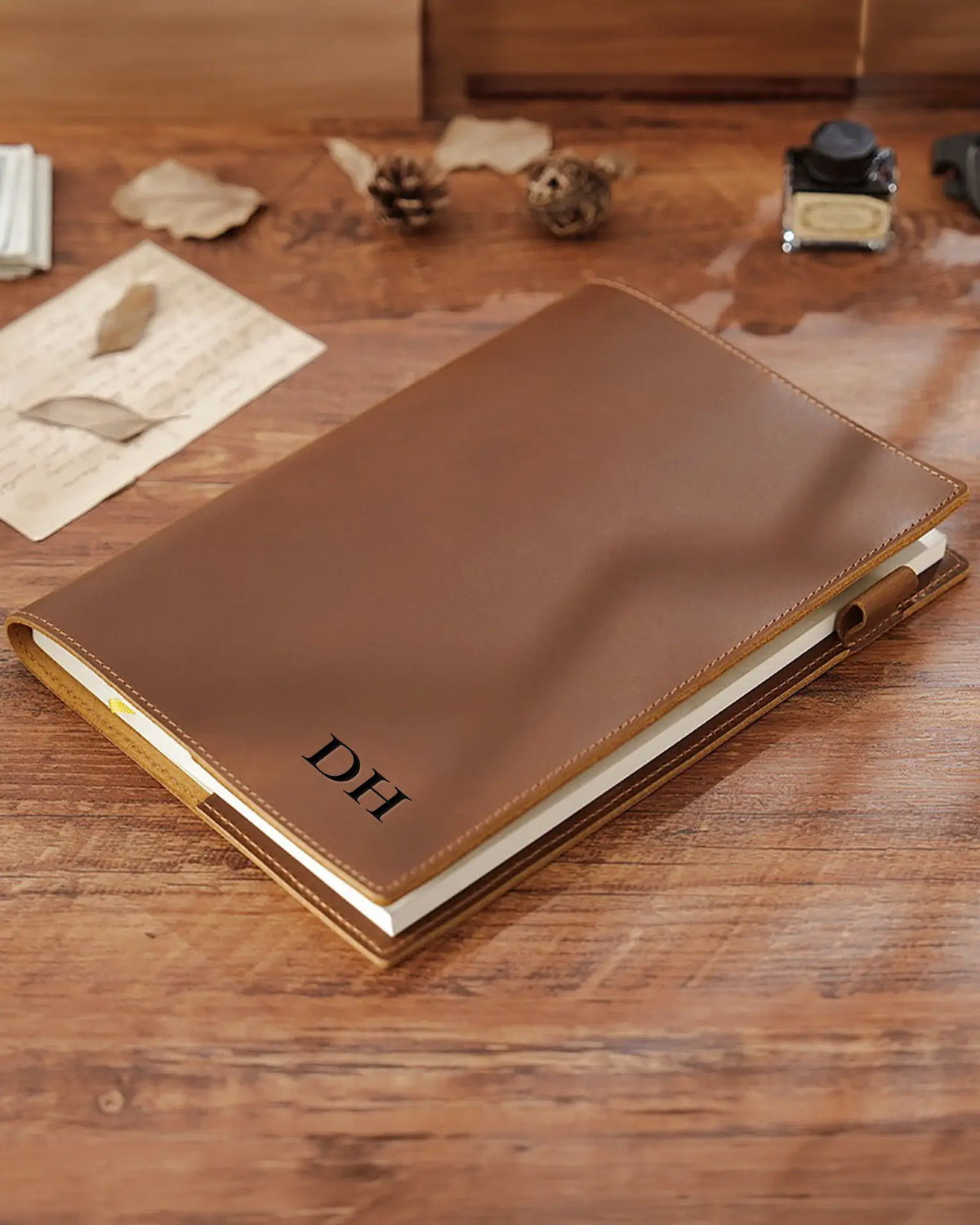 Personalized Cognac B5 leather journal with engraved initials on the front cover