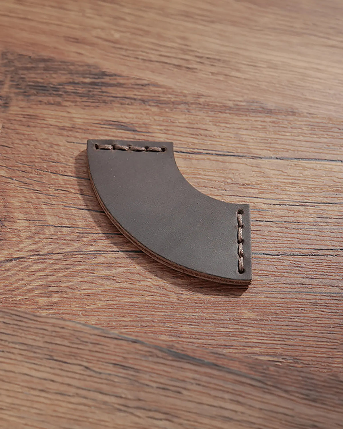 Espresso brown leather corner bookmark with curved design and matching stitching