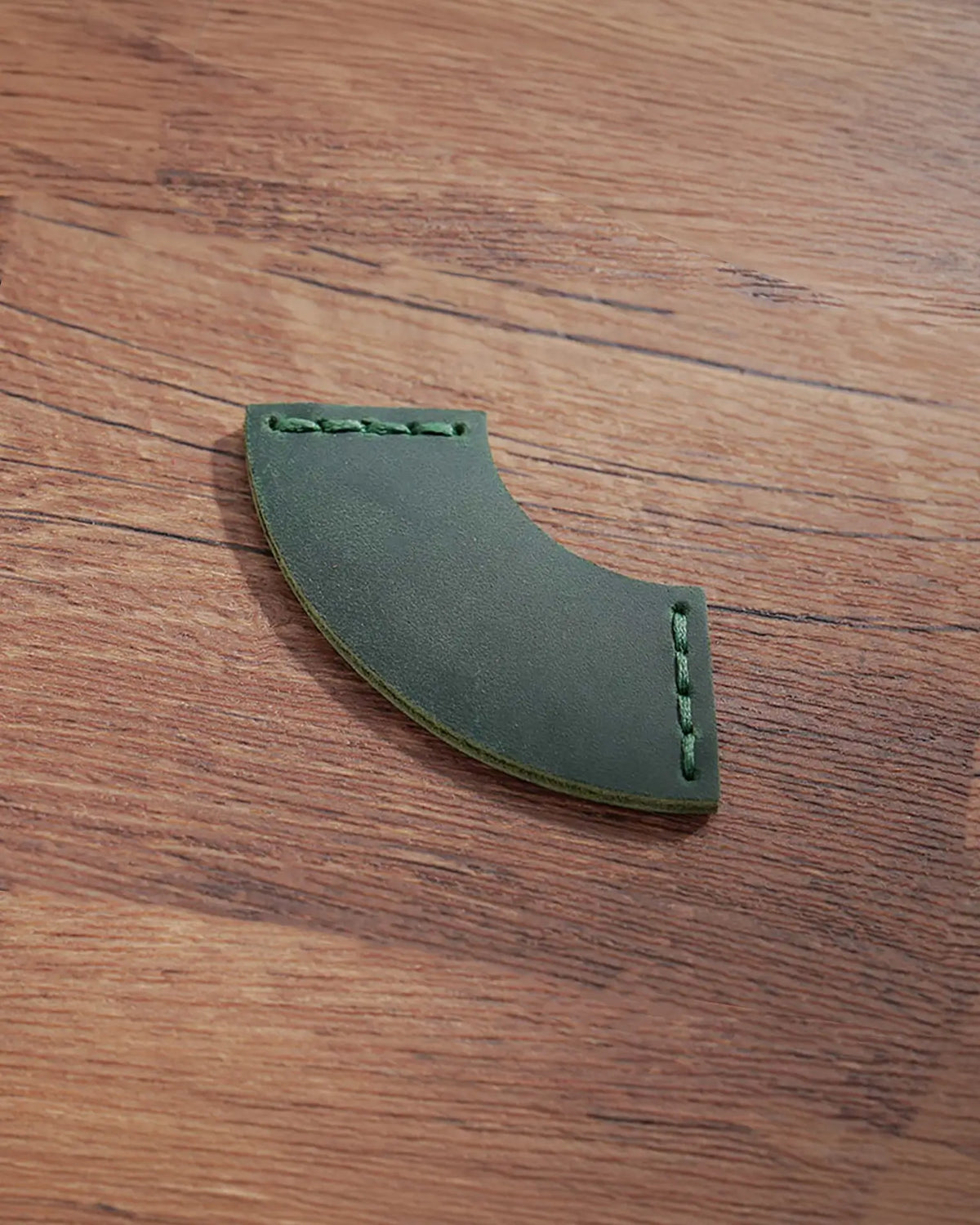 Forest Green leather corner bookmark with curved fan shape and matching stitching