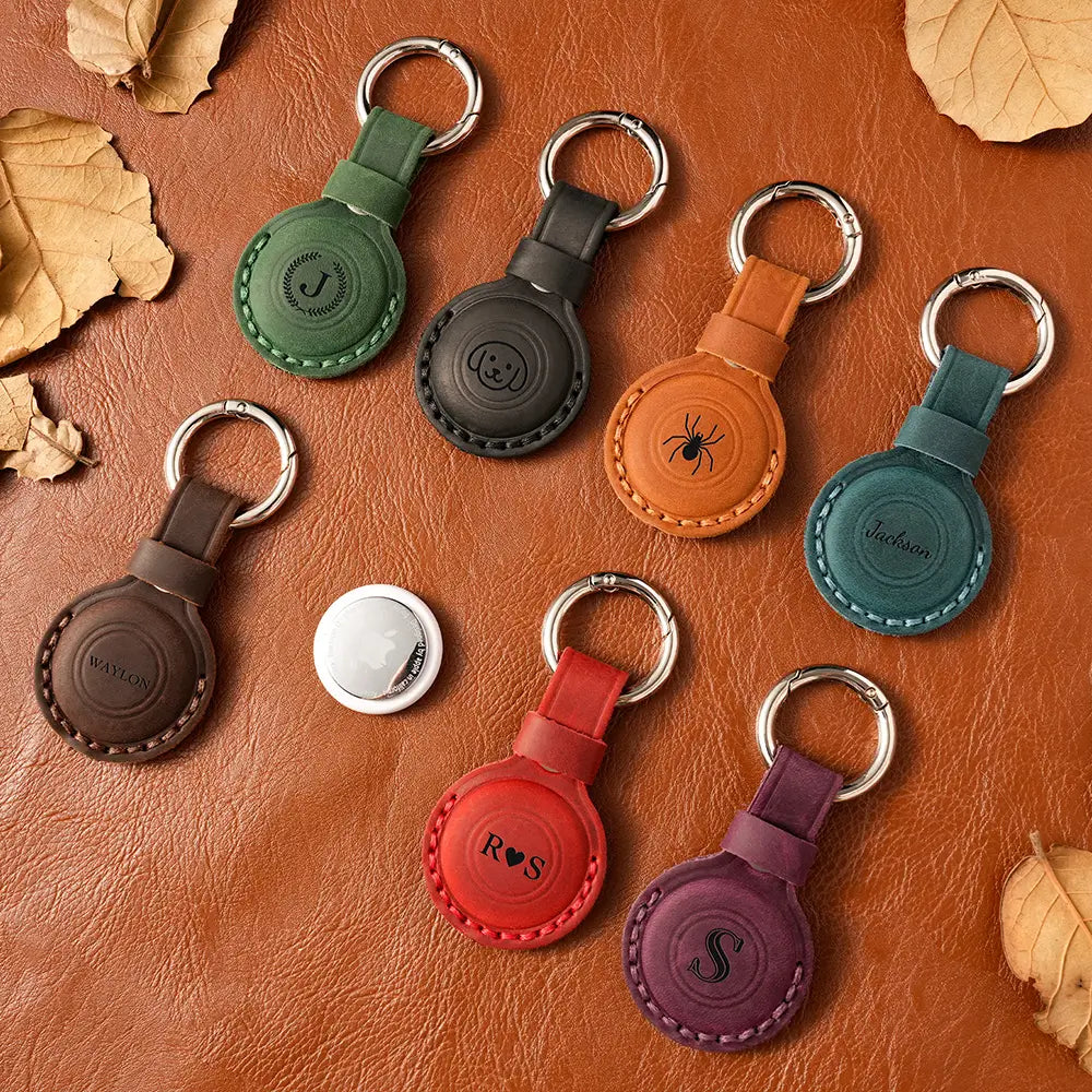 Collection of personalized leather AirTag cases in seven colors