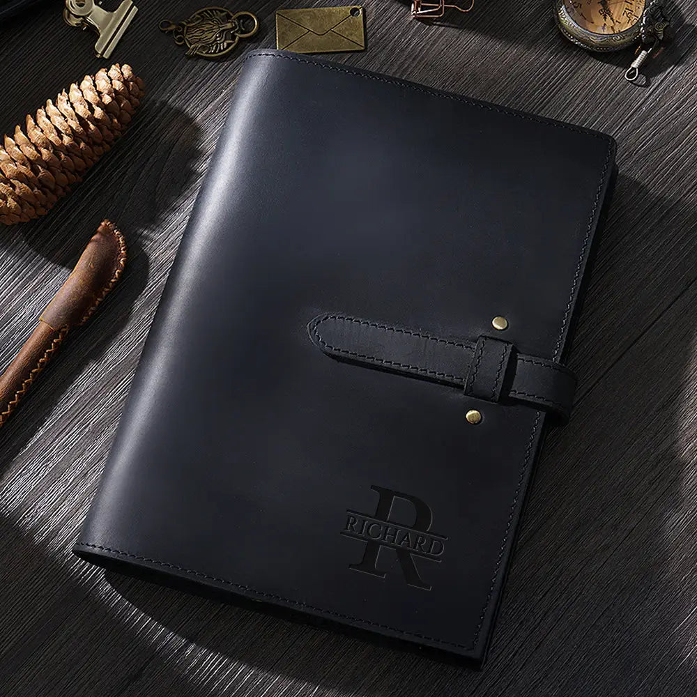 Black handmade leather journal with brass buckle and personalization