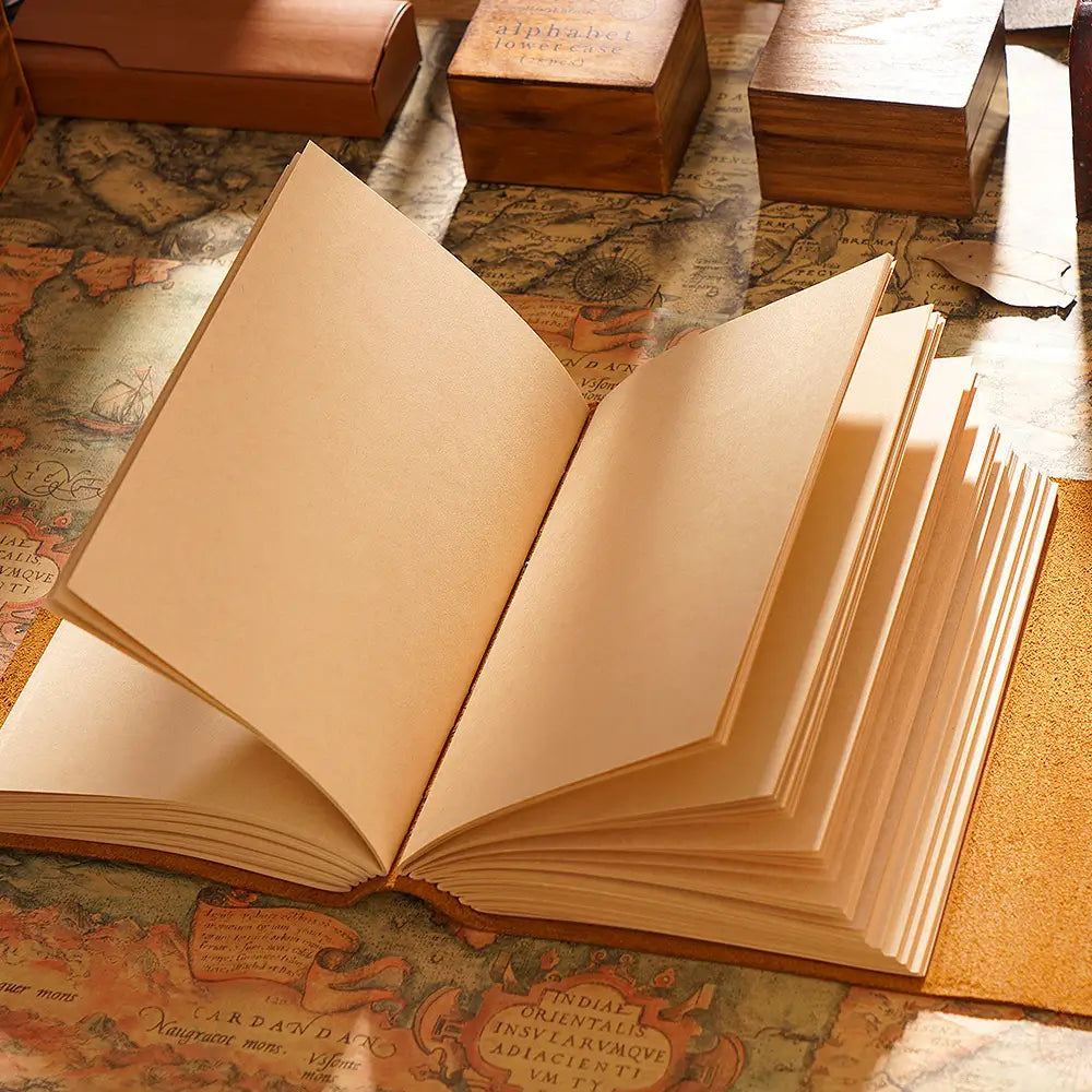 Refillable leather journal open showing 100gsm blank pages