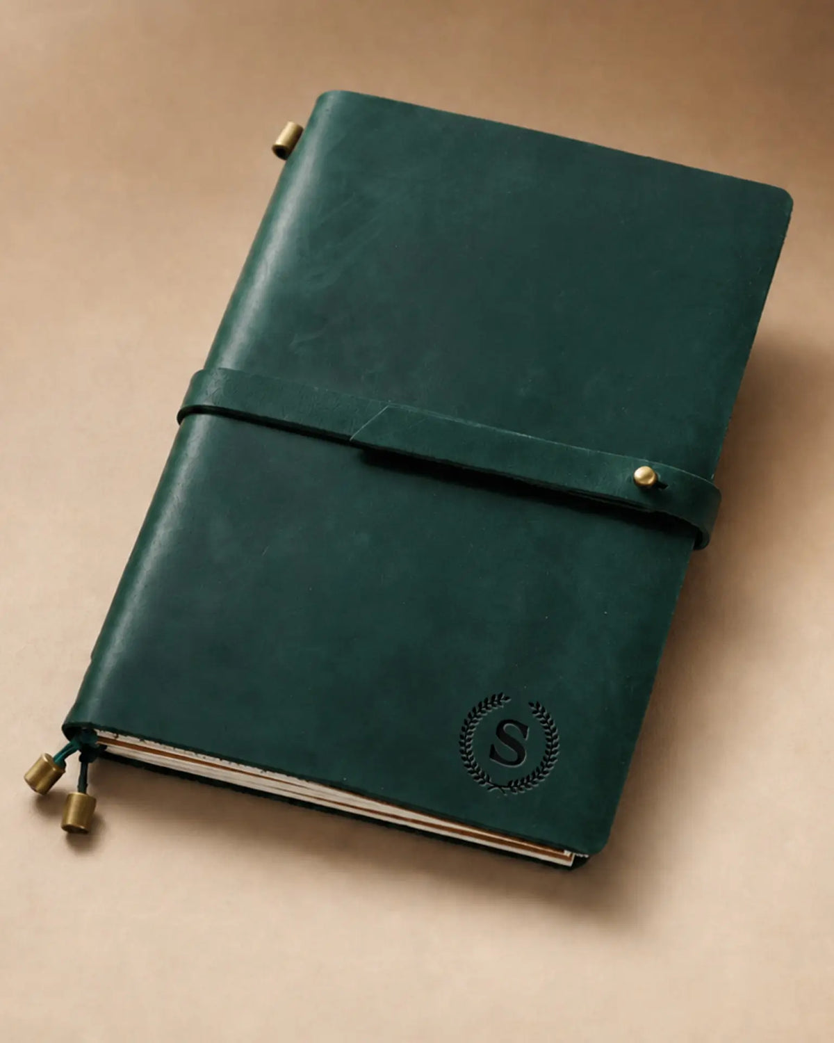 Forest Green A5 leather traveler’s notebook with wrap strap and monogram example