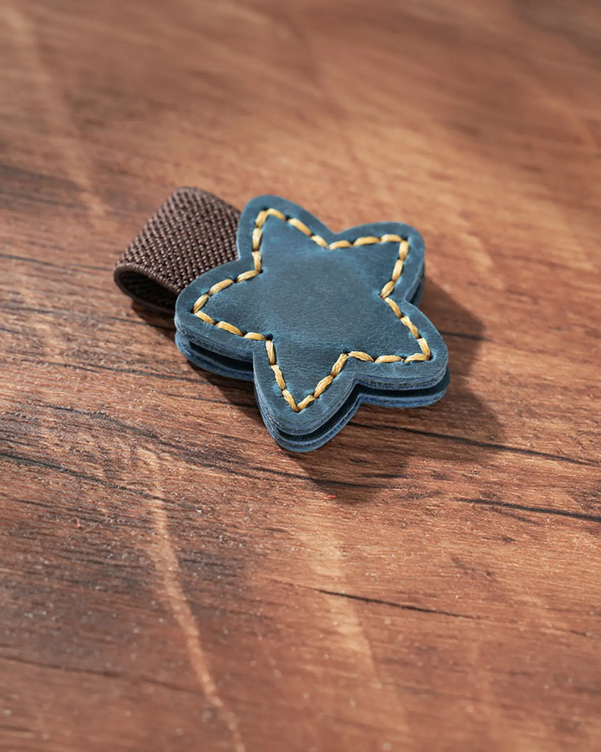 Teal Blue leather star magnetic bookmark with contrast stitching and elastic pen holder