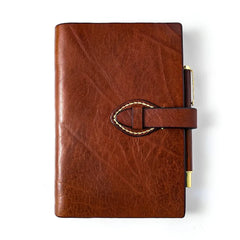 Brown refillable leather journal with strap closure front view