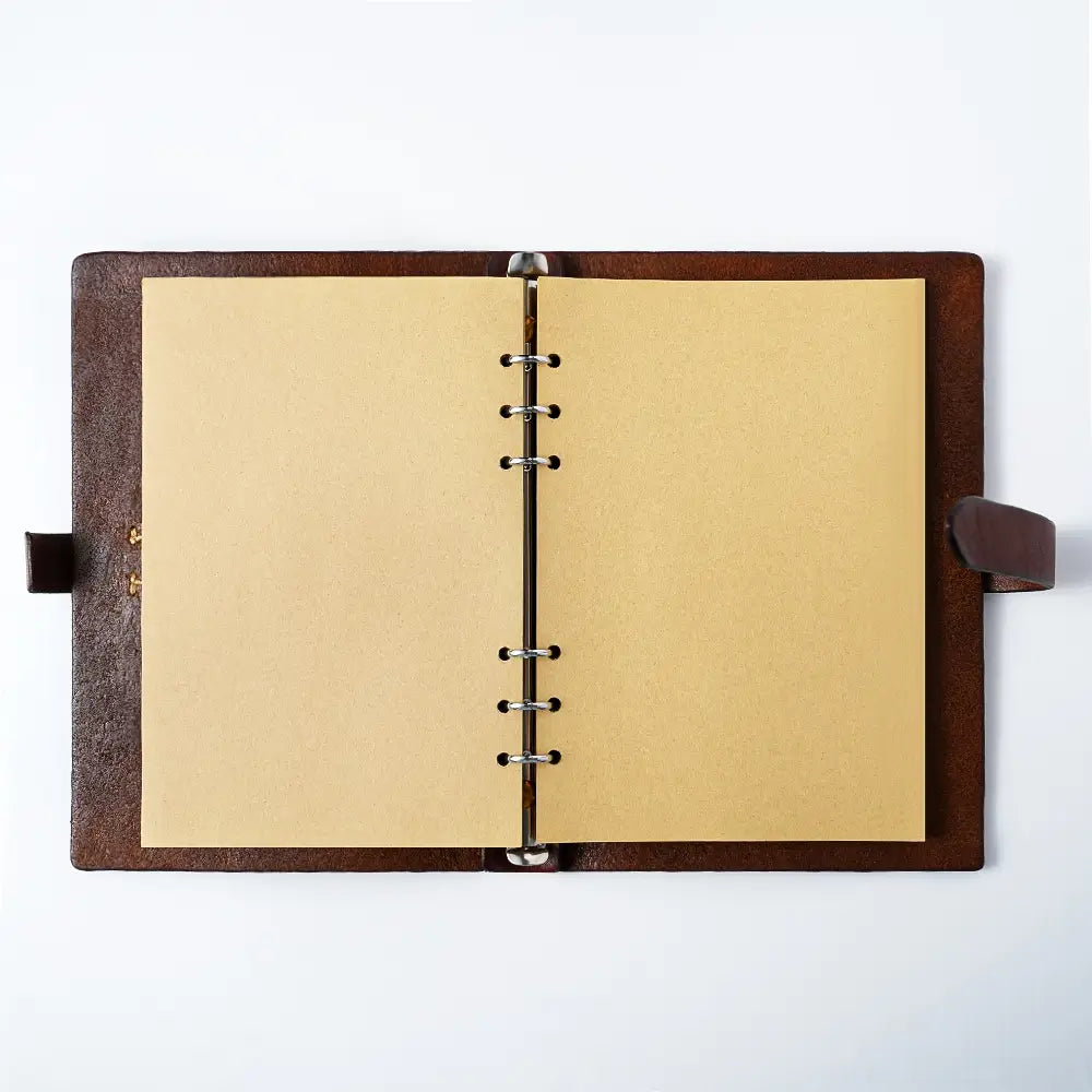 Open leather journal with kraft paper pages and 6-ring binder