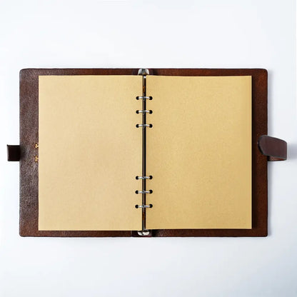 Open leather journal with kraft paper pages and 6-ring binder