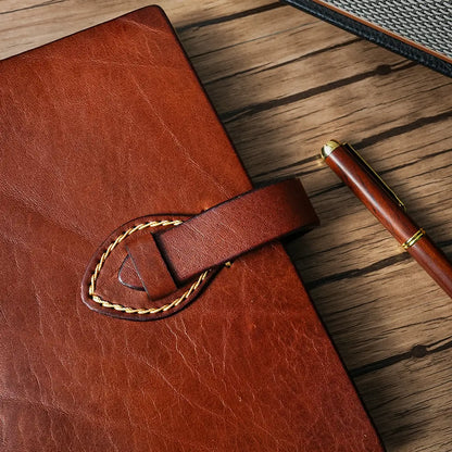 Handmade leather journal with loop closure and contrast stitching