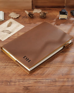 Personalized Cognac B5 leather journal with engraved initials on the front cover