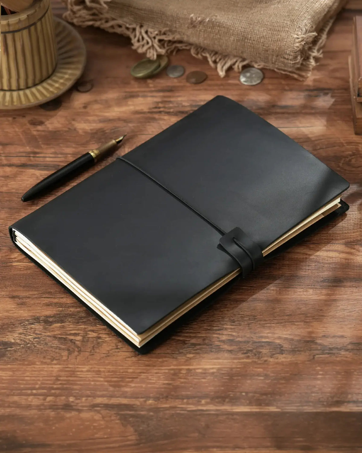 Black B5 refillable leather traveler’s notebook with elastic closure

