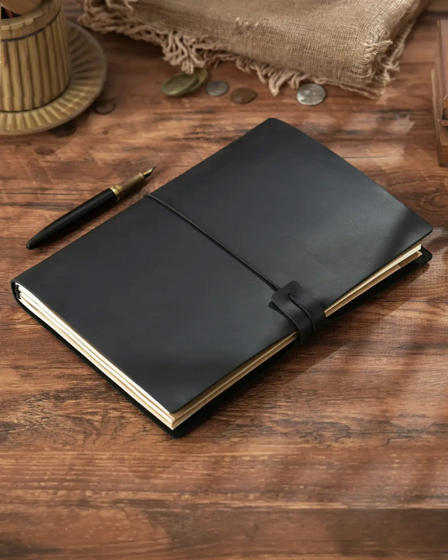 Black B5 refillable leather traveler’s notebook with elastic closure
