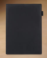 Black B5 refillable leather journal with stitched cover and built-in pen loop
