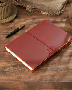 Crimson B5 refillable leather traveler’s notebook with elastic closure
