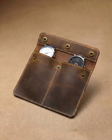 Open brown double-watch sleeve holding two watches