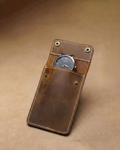 Open warm brown watch sleeve holding one watch