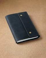 Closed black folio A5 journal