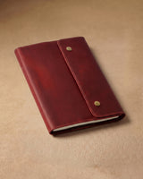 Closed crimson folio A5 journal in a front view
