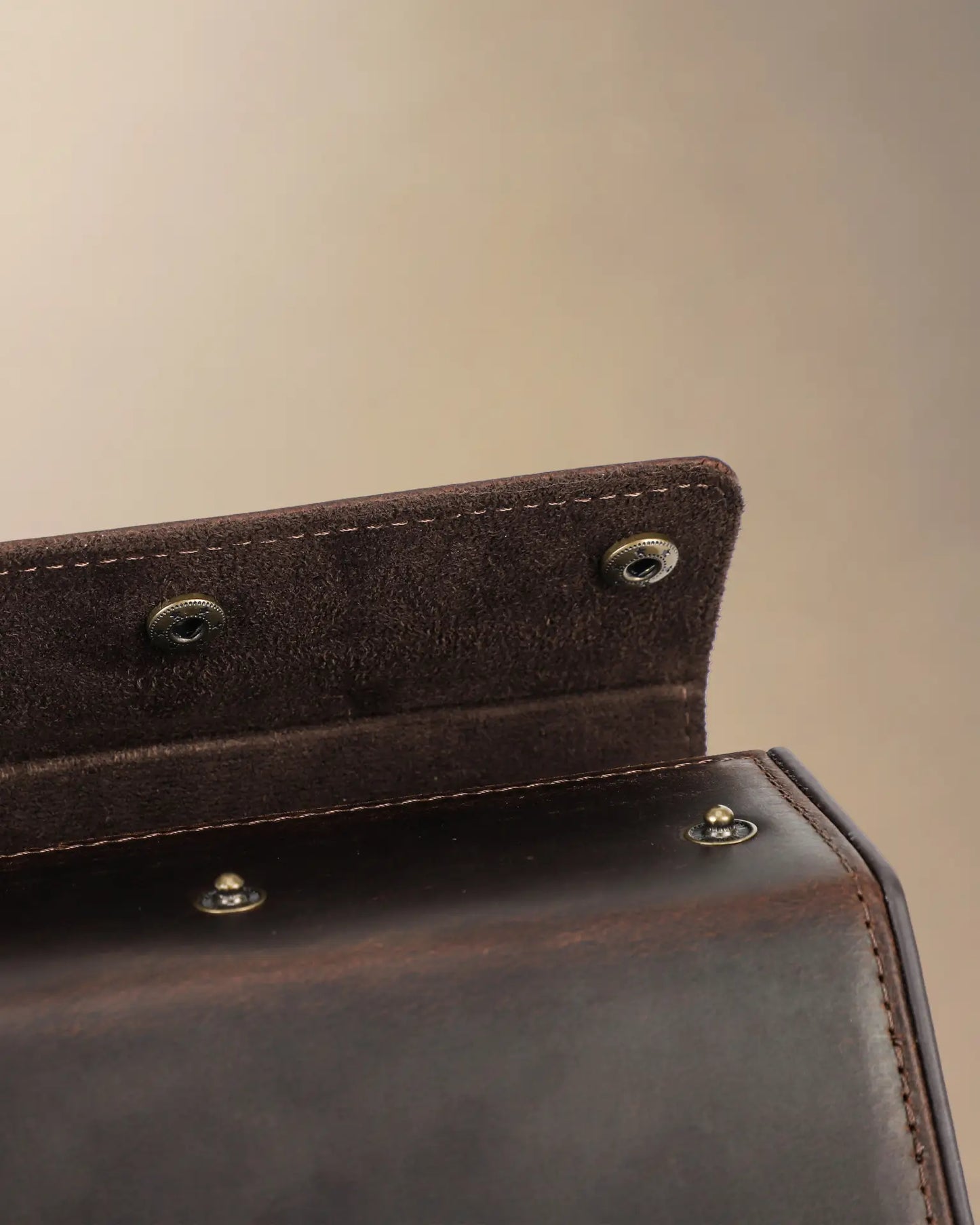Close up of double brass snap closure on Legacy Hex leather watch box