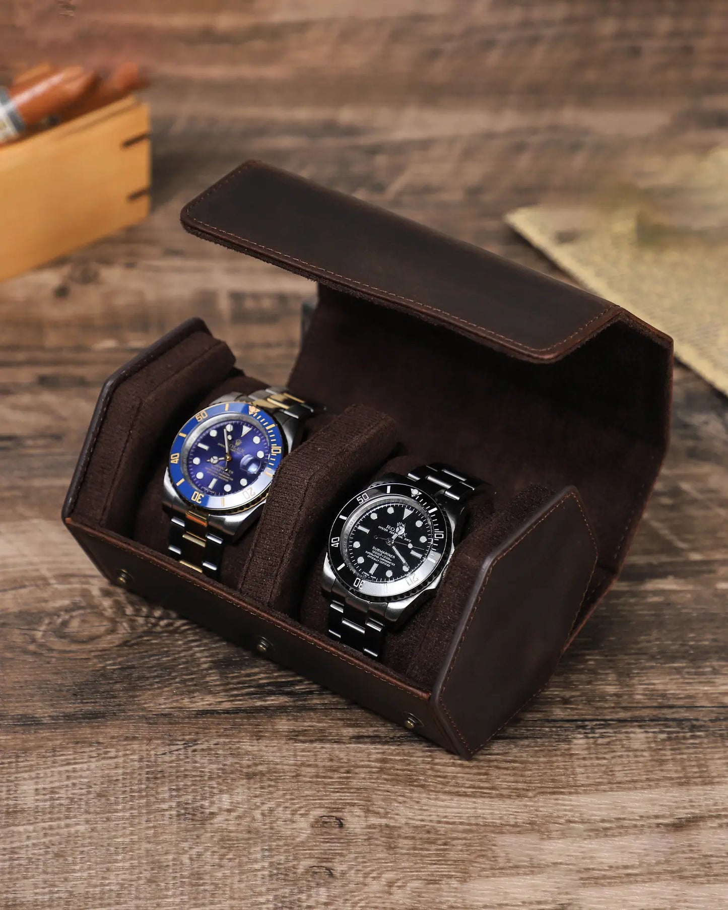 Legacy Hex 2 slot watch box open on wooden desk with luxury watches displayed
