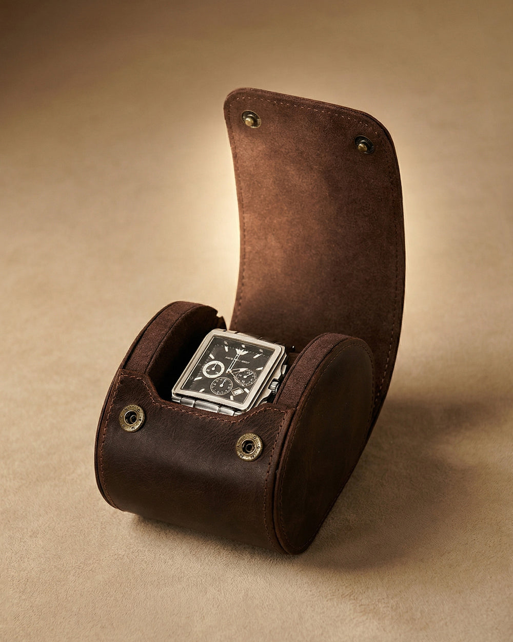 Open dark brown single-watch roll holding a square-face watch