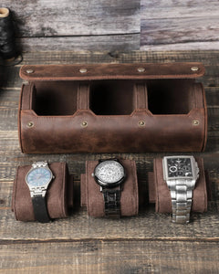 Open empty three-watch roll above three watches on removable pillows
