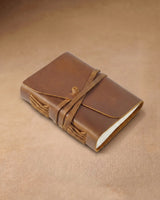 Closed cognac wrap journal in a front three-quarter view