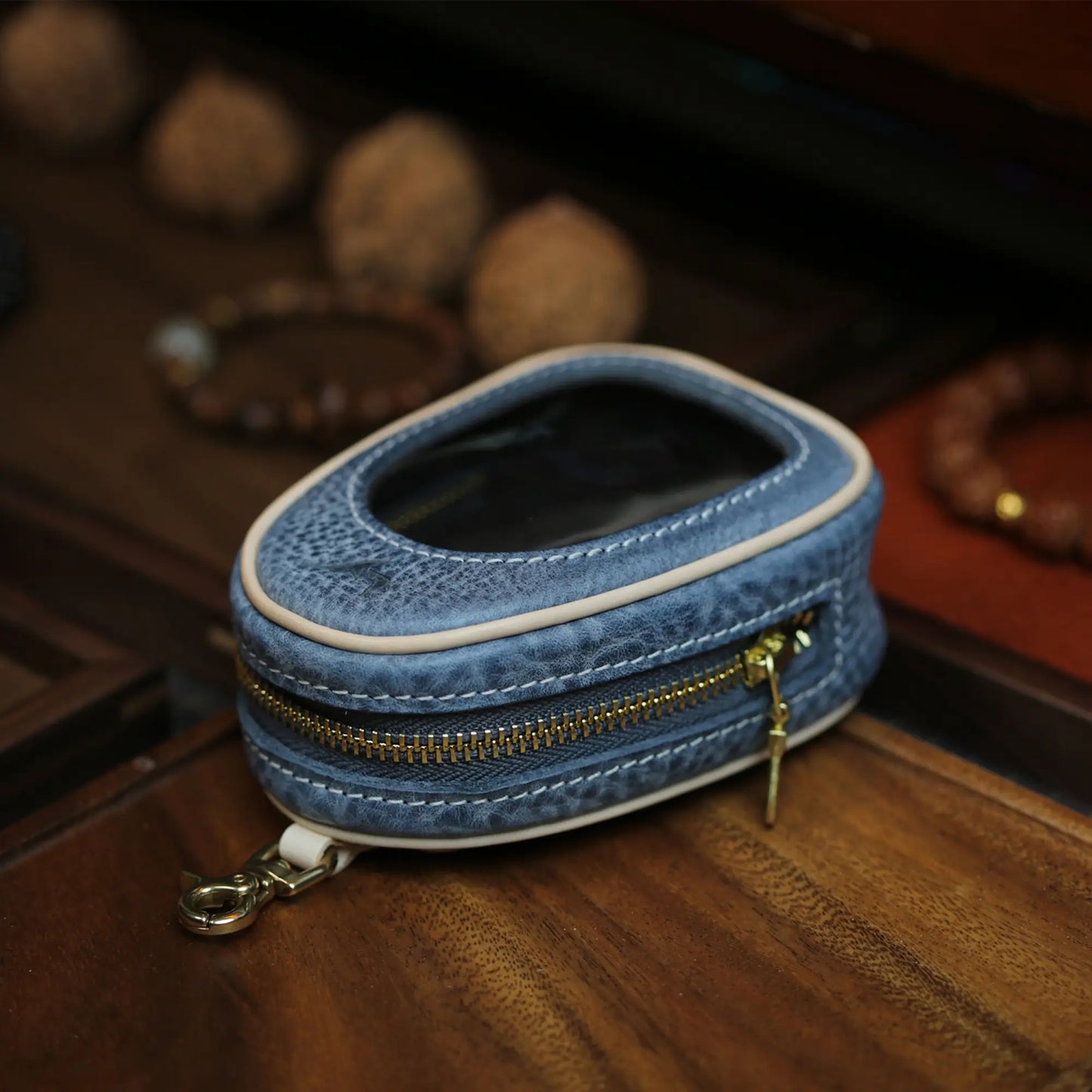 Blue full grain leather window pouch with antique gold zipper and clasp hook