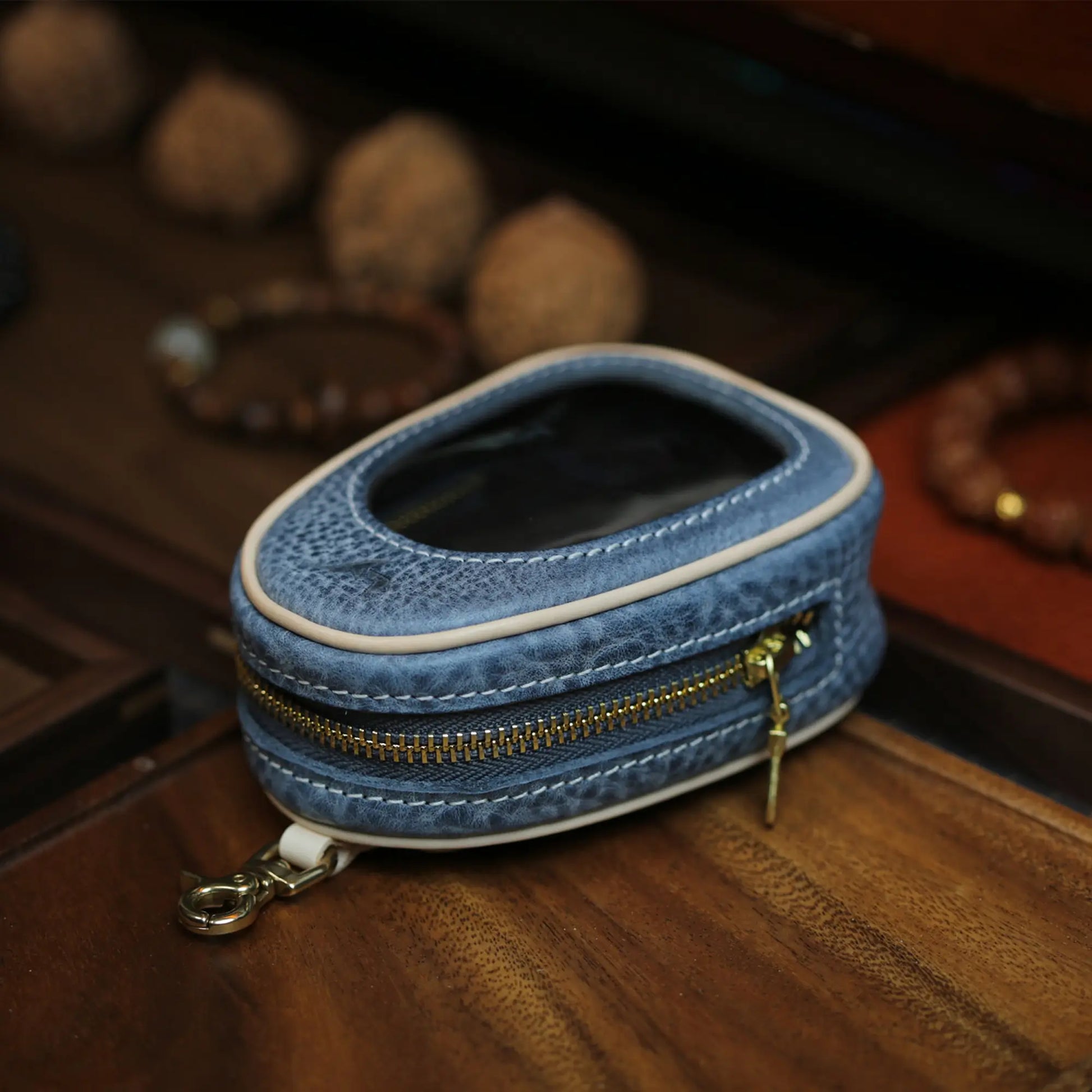 Blue full grain leather window pouch with antique gold zipper and clasp hook