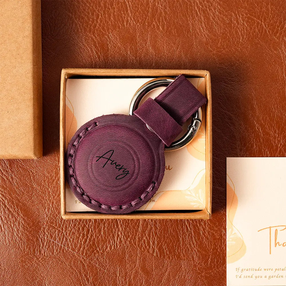 Purple leather AirTag case with initials