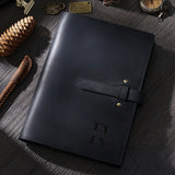 Black handmade leather journal with brass buckle and personalization
