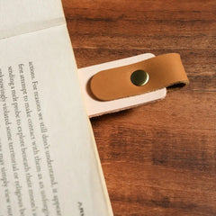 Personalized leather bookmark on open book