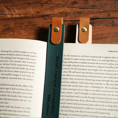 Personalized leather bookmark on open book