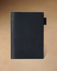 Black A6 leather writing folio with stitched cover and pen loop