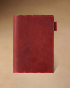 Crimson A6 leather writing folio with stitched cover and pen loop
