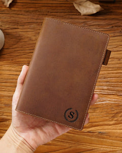 Cognac A6 leather writing folio shown with an engraved initial