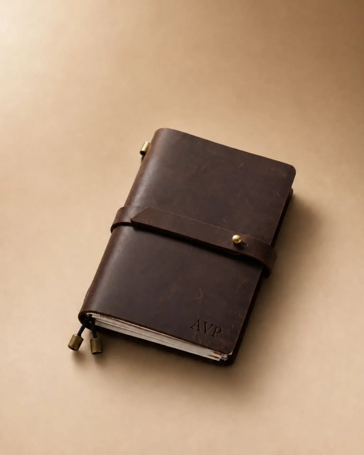Espresso Passport-Size leather traveler’s notebook with wrap strap and monogram example