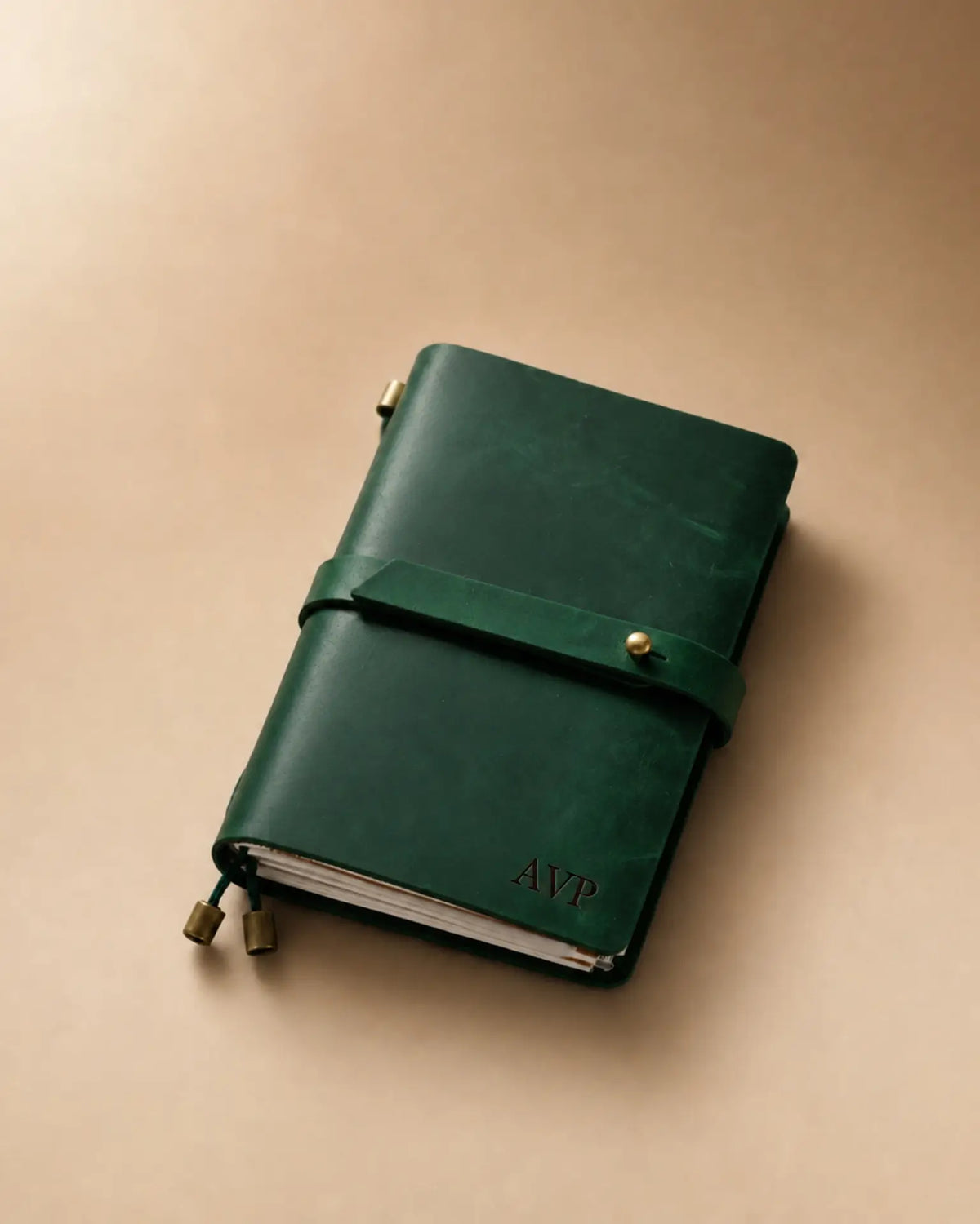 Forest Green Passport-Size leather traveler’s notebook with wrap strap and monogram example