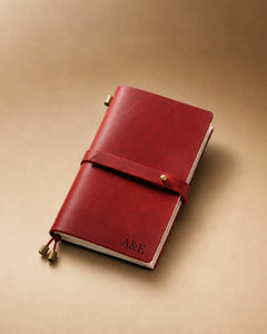 Crimson Personal-Size leather traveler’s notebook with wrap strap and monogram example