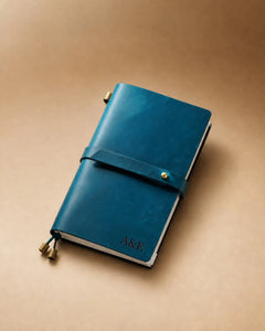 Teal Blue Personal-Size leather traveler’s notebook with wrap strap and monogram example