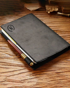 Black A5 leather writing folio shown with an engraved initial