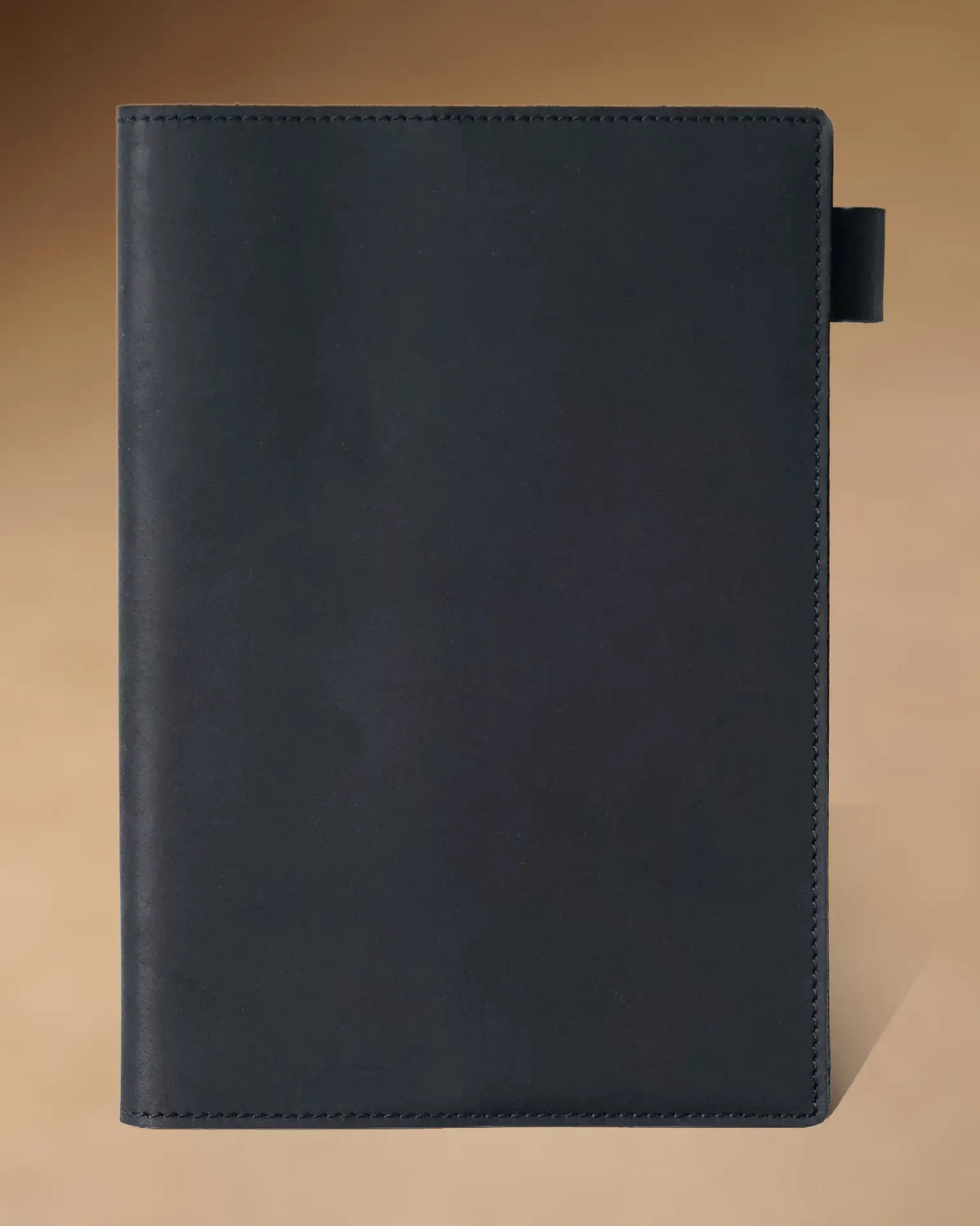 Black A5 leather writing folio with stitched cover and pen loop