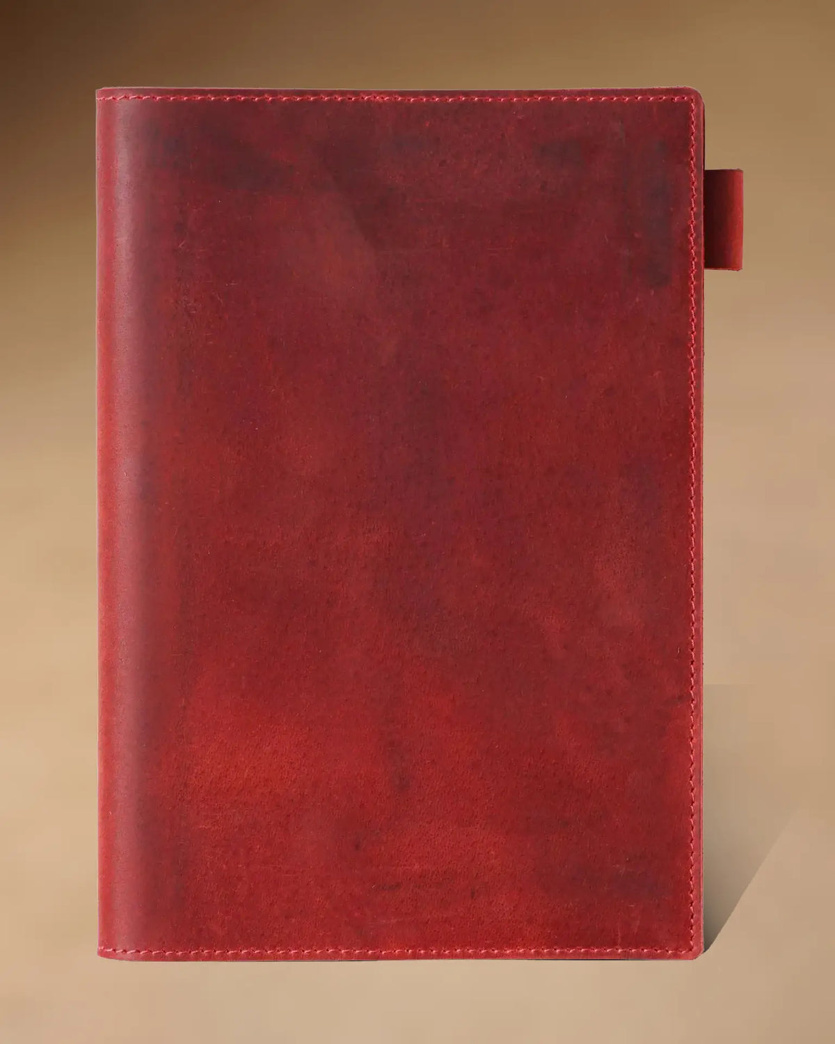 Crimson A5 leather writing folio with stitched cover and pen loop