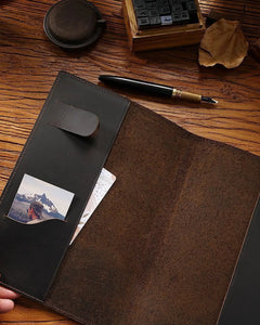 Open Espresso A5 leather writing folio showing interior pockets and cover sleeve