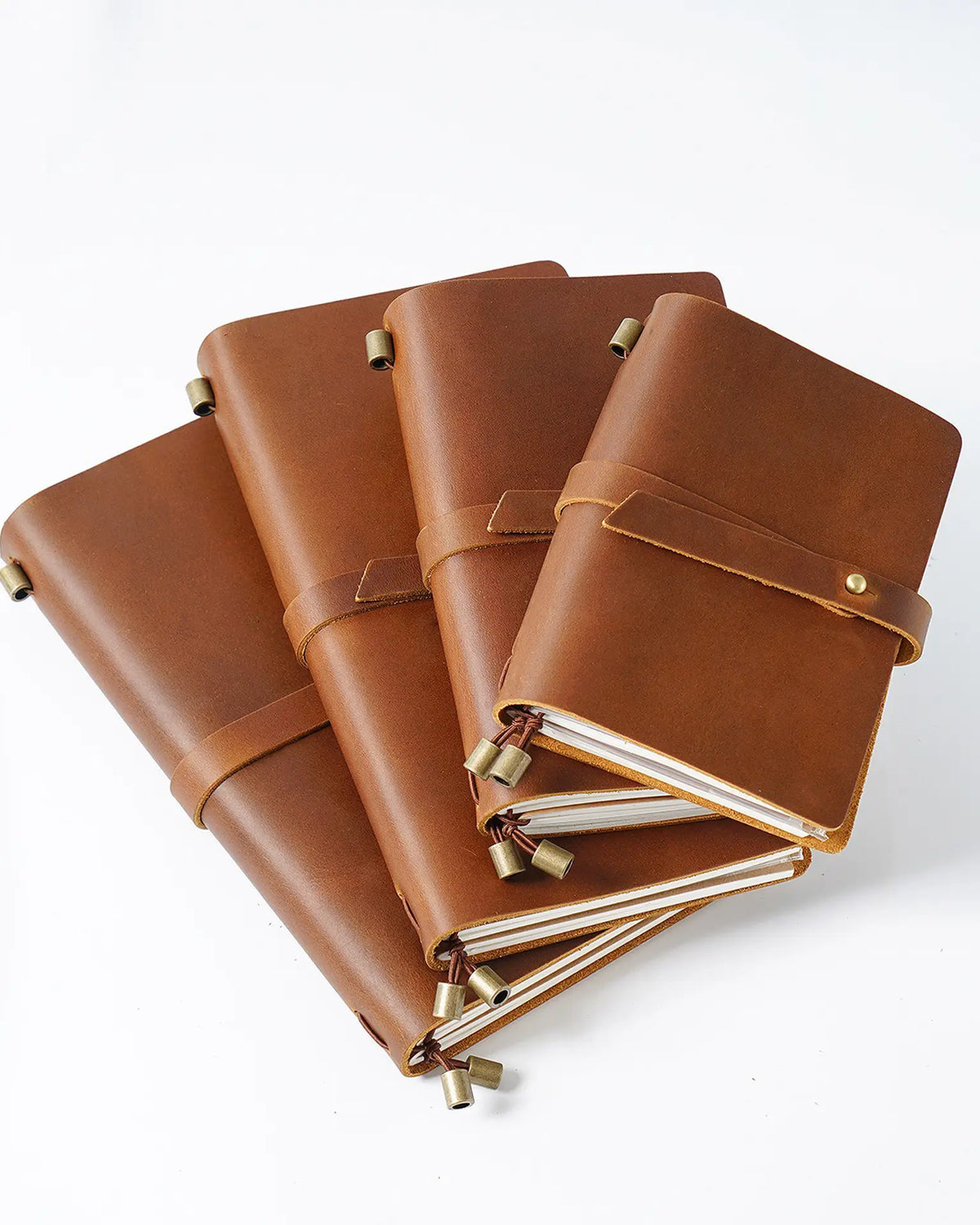 Cognac Journey Wrap leather notebooks in four cover sizes
