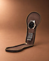 Journey Zip Single Watch Case in Espresso, open with a watch laid flat inside.