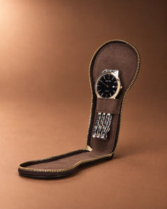 Journey Zip Single Watch Case in Espresso, open with a watch laid flat inside.