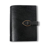 Closed black journal isolated on a white background