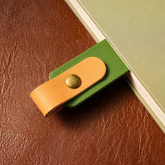 Personalized leather bookmark on open book page