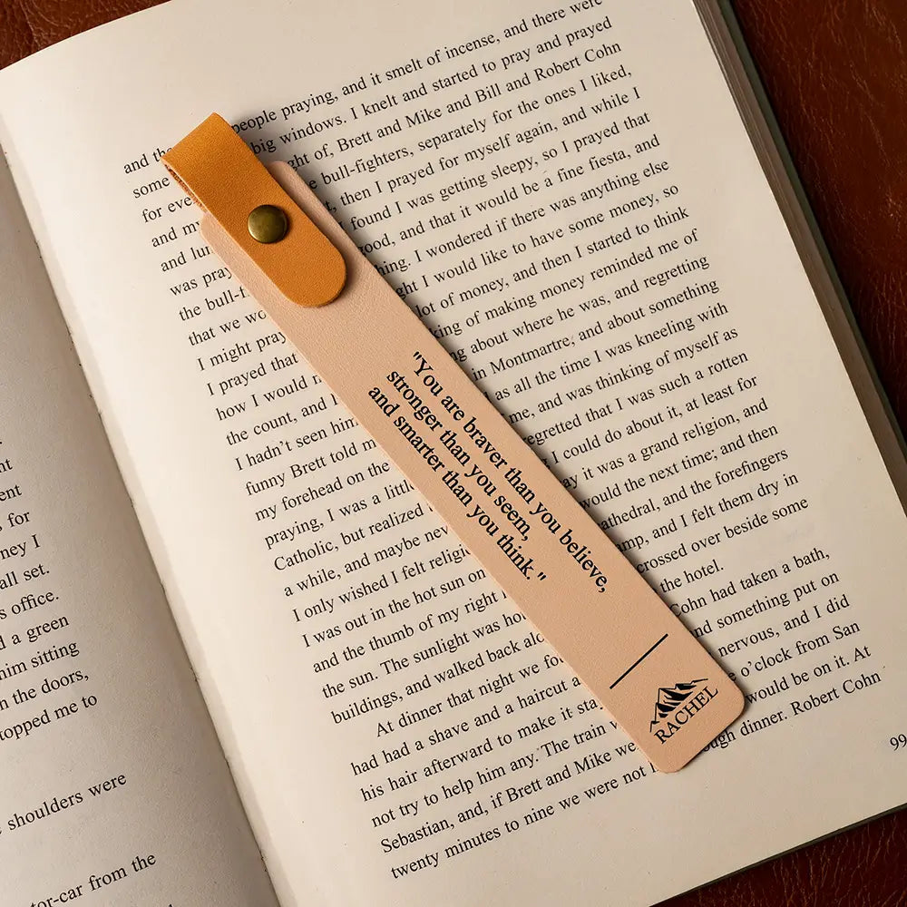 Bookmark with motivational quote on an open book